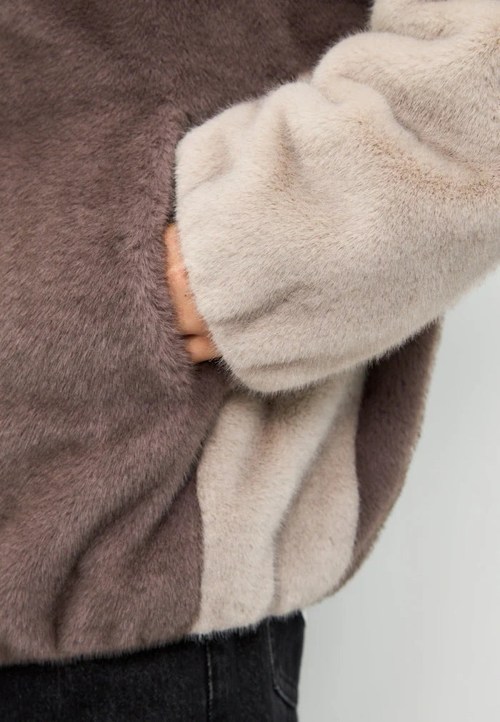 A stylish brown faux fur hooded jacket, the Reyna faux fur jacket for women's fashion.