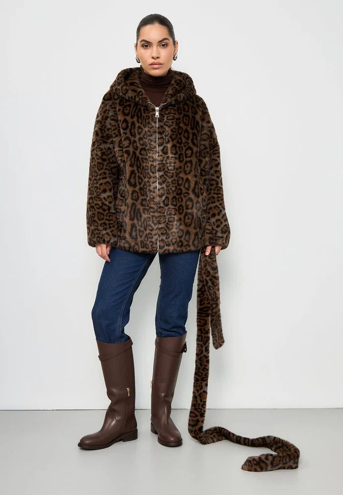 A trendy women's faux fur jacket with a hooded leopard design known as the Reyna leopard jacket, perfect for chilly weather and stylish outings.