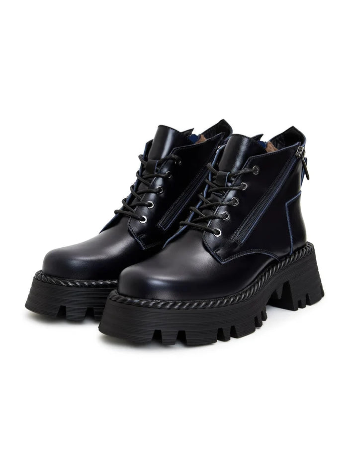A pair of fashionable blue lace-up ankle boots, a stylish choice for any outfit.