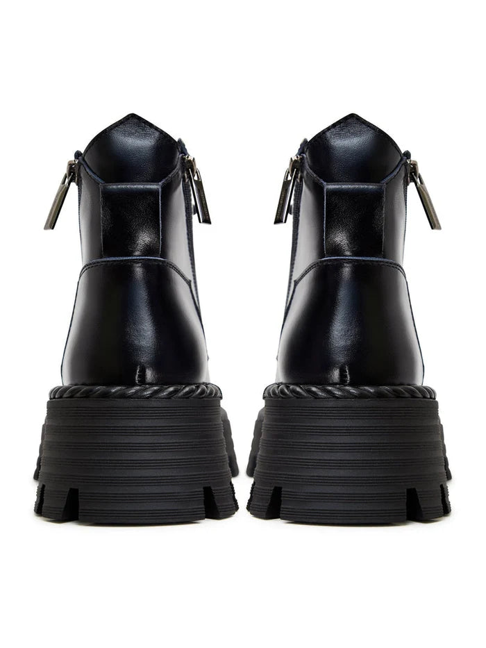 A pair of stylish lace-up ankle boots in blue, perfect for a fashionable look.