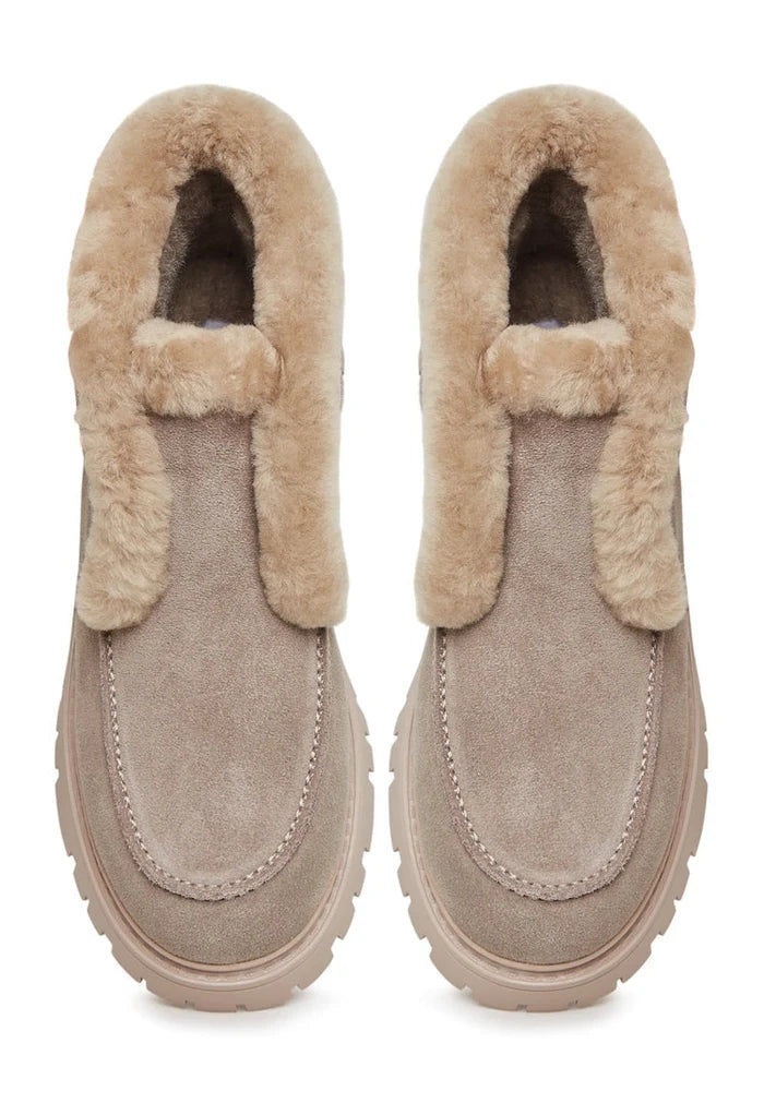 A stylish pair of women's suede ankle winter boots perfect for the cold season.