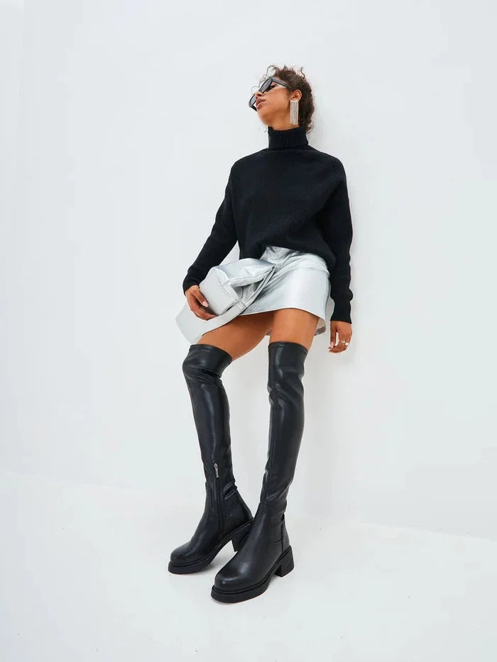 A stylish pair of over-the-knee suede boots, the epitome of chic fashion boots for women.