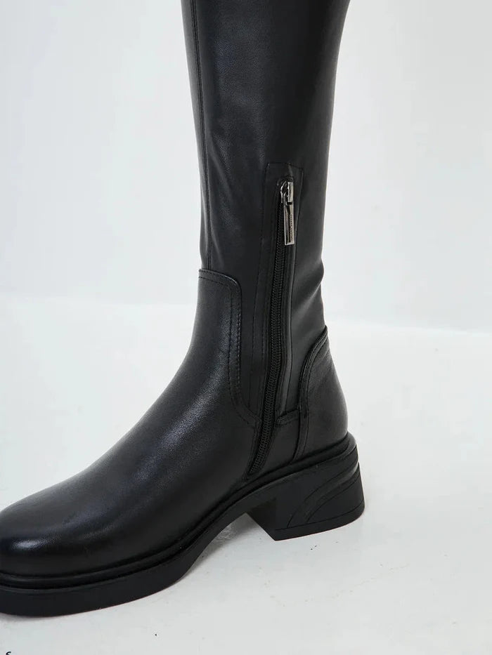 A stylish pair of over-the-knee suede boots, the perfect chic fashion statement in women's footwear.