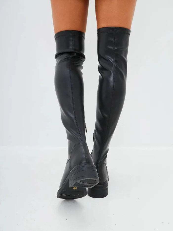A stylish pair of women's over-the-knee suede boots, a chic and trendy choice for fashion-forward individuals.