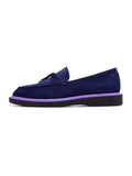 A stylish pair of navy blue suede slip-on loafers for men.