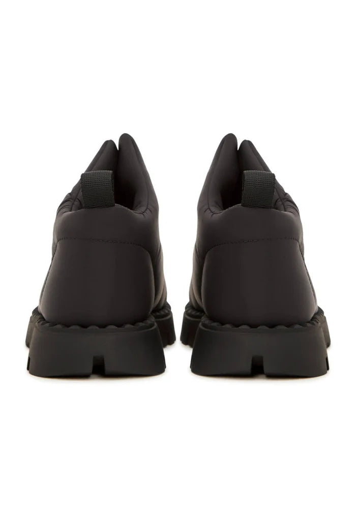 A pair of stylish black suede winter boots with cozy wool lining, perfect for staying warm and fashionable during the colder months.