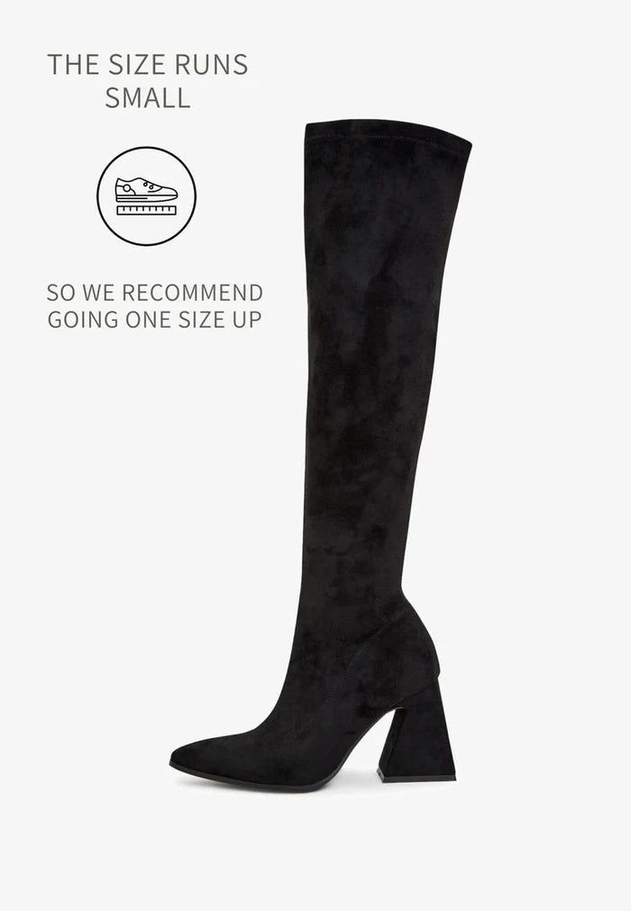 A pair of designer thigh-high boots crafted from high-end suede, representing luxury women's boots as premium over-the-knee footwear, exclusive in style and quality.