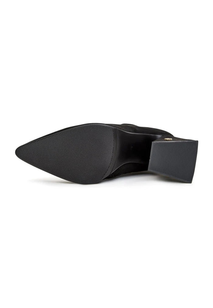 A pair of designer thigh-high boots in high-end suede, luxury women's footwear at its finest.