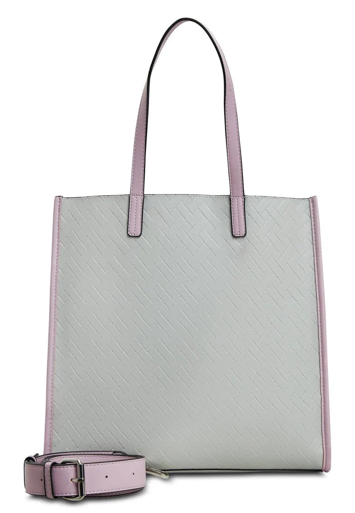 A woman's hand holding a stylish grey tote bag, perfect for everyday use and a fashionable accessory.