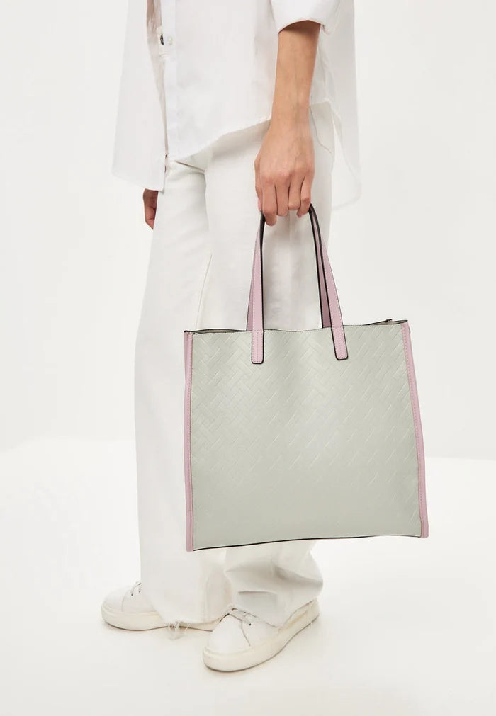 A stylish grey tote bag perfect for any outfit, great for carrying all your essentials.