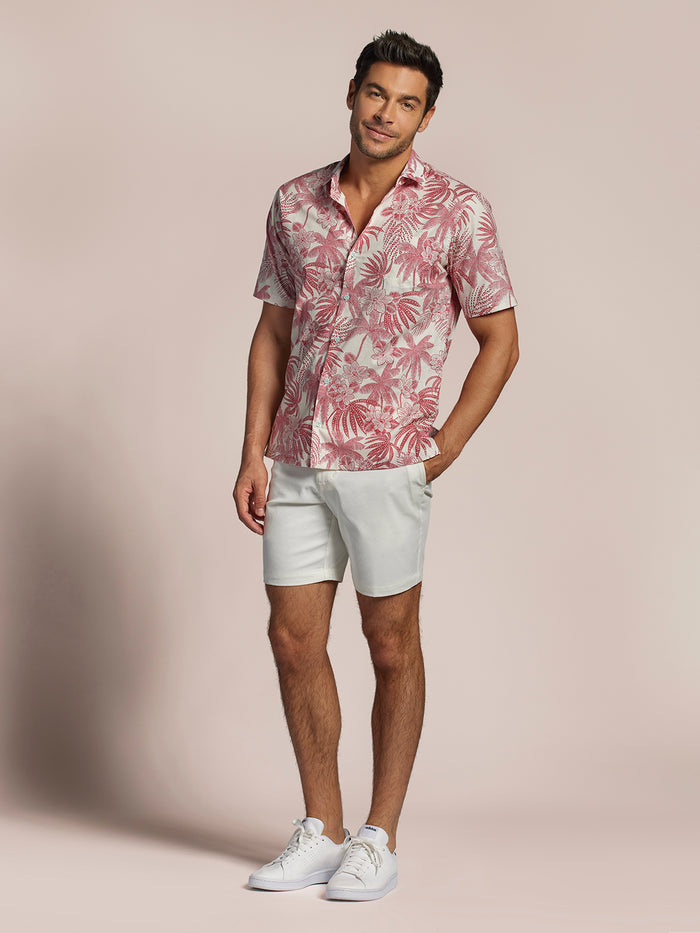 Pink floral print cotton lawn short-sleeve shirt with white shorts, front view.