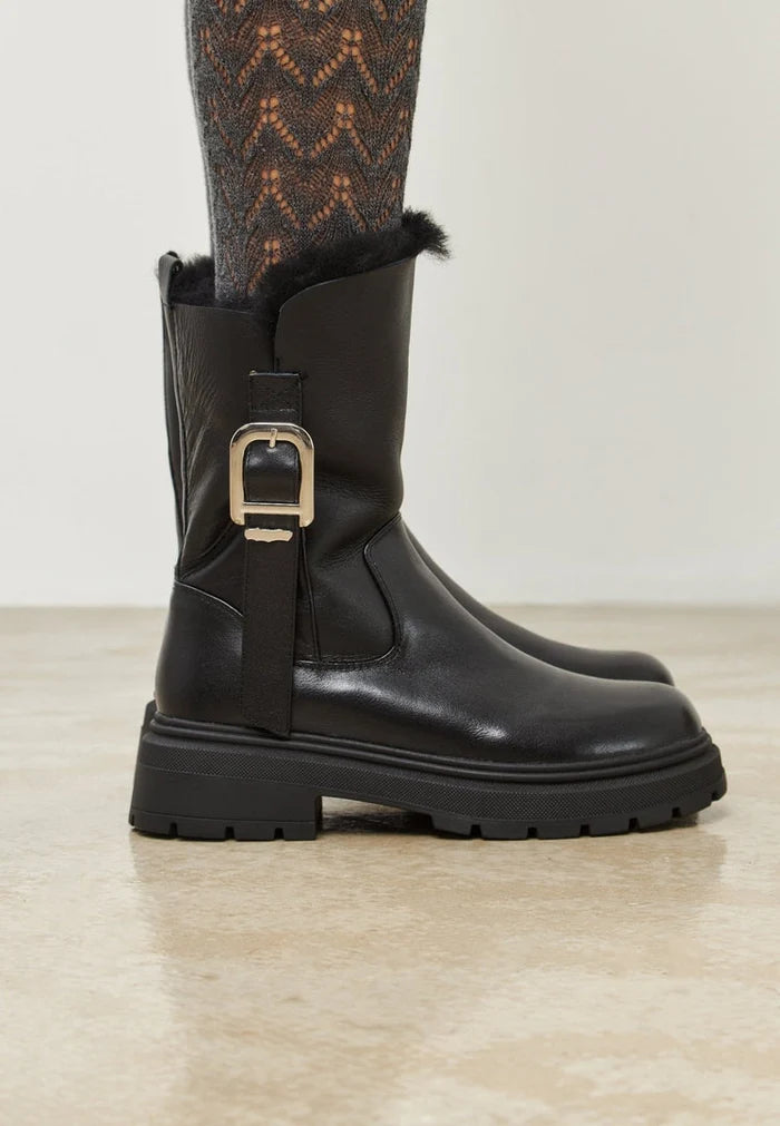 A stylish pair of trendy leather platform ankle boots, perfect urban style footwear that's both fashionable and edgy.