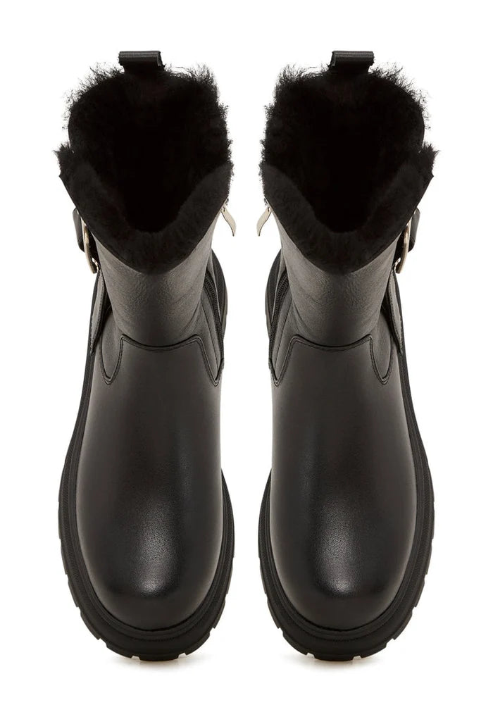 A trendy and fashionable pair of leather platform ankle boots, perfect for urban style footwear enthusiasts.