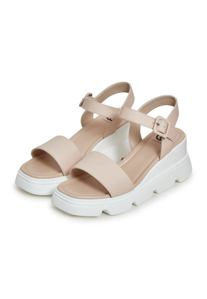 A stylish pair of leather platform sandals in a modern urban design, ideal for chic and trendy urban footwear looks.