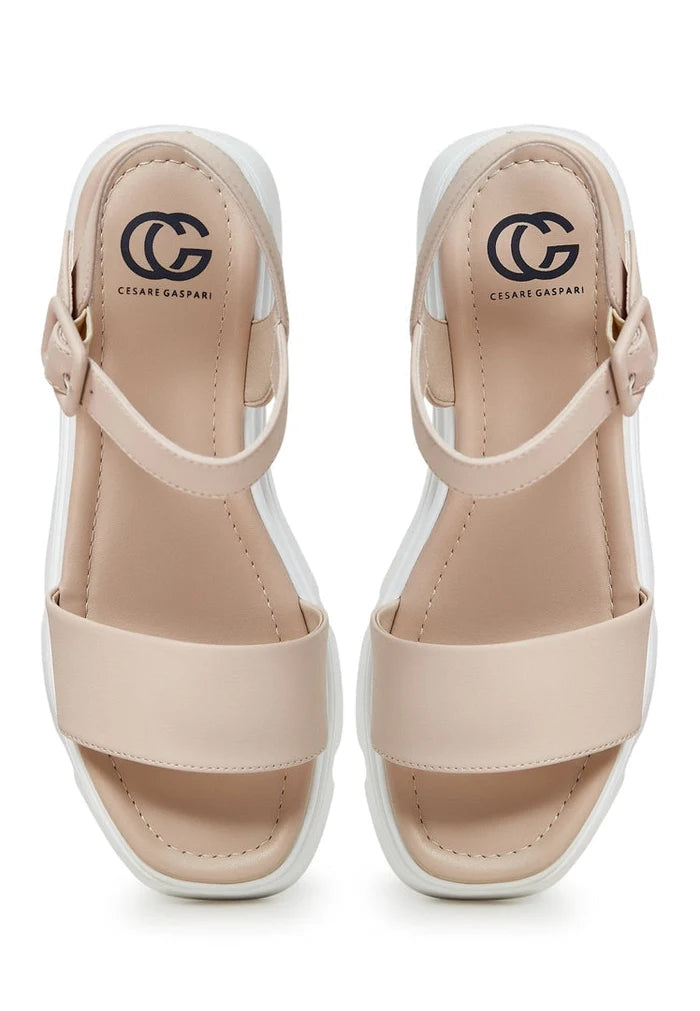 A stylish pair of leather platform sandals, perfect for urban wear, combining the comfort of platform design with the elegance of leather, making them a must-have in your collection of urban footwear.