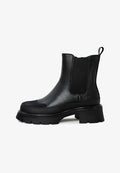 A stylish pair of black urban ankle boots with a platform design, perfect for women's fashion footwear.