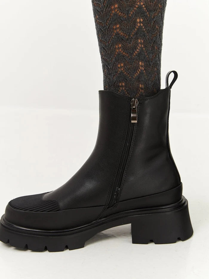 A stylish pair of black urban ankle boots with a platform design, perfect for any woman's fashion footwear collection.