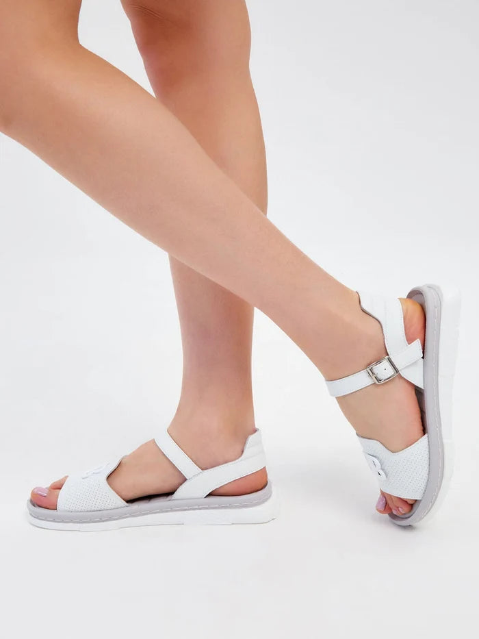 A pair of trendy white platform sandals perfect for the urban fashionista.