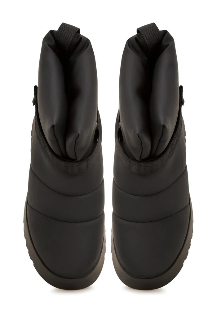A pair of sleek black wool-lined winter boots perfect for city streets with a cozy wool lining for extra warmth.