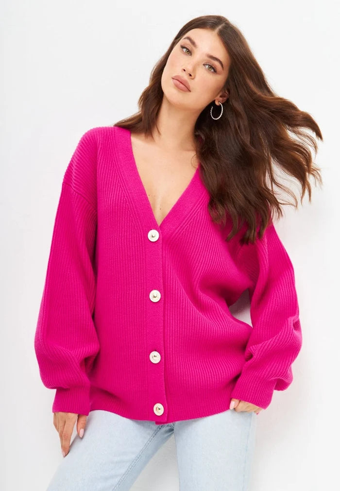A stylish pink V-neck cardigan perfect for women, featuring a cozy knit design - the ultimate fashion statement for any outfit.