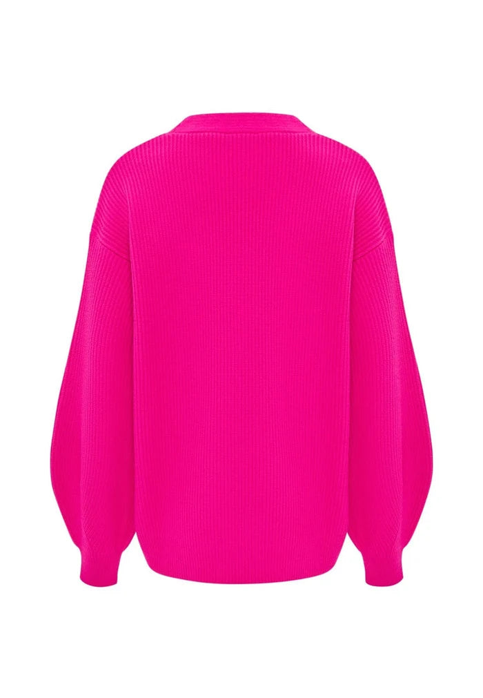 A stylish pink V-neck cardigan for women, perfect for adding a fashionable layer to your outfit.