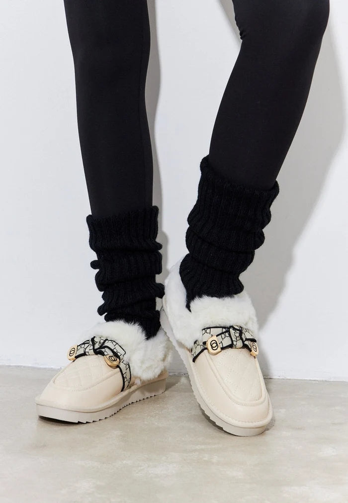 Stay cozy and stylish with these off white padded slip-on loafers, the perfect warm and comfortable shoes for any occasion.