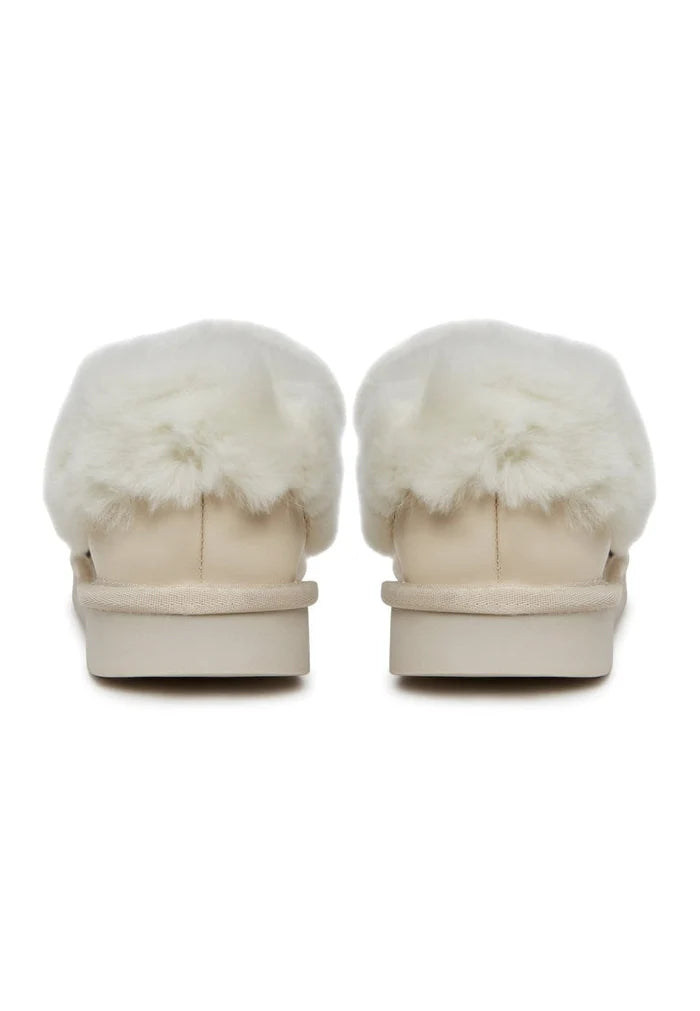 Stay cozy and stylish in these off white loafers, perfect for chilly days with their warm padding and slip-on design.
