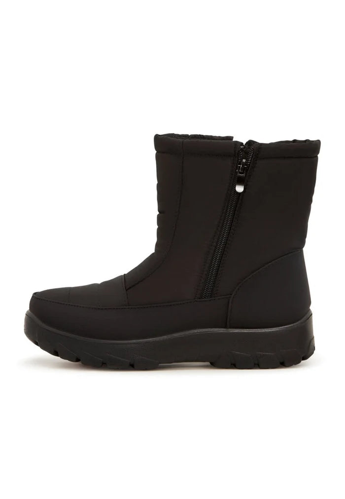 Stay warm and stylish this winter with these cozy suede boots - perfect for cold weather fashion.