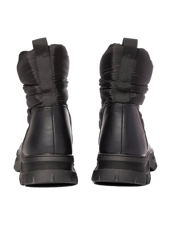 A pair of stylish black winter boots, perfect for cold weather and snow - a must-have for anyone looking for waterproof winter footwear.