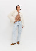 A stylish white faux fur winter jacket, perfect for cold weather outerwear and a fashionable winter coat.