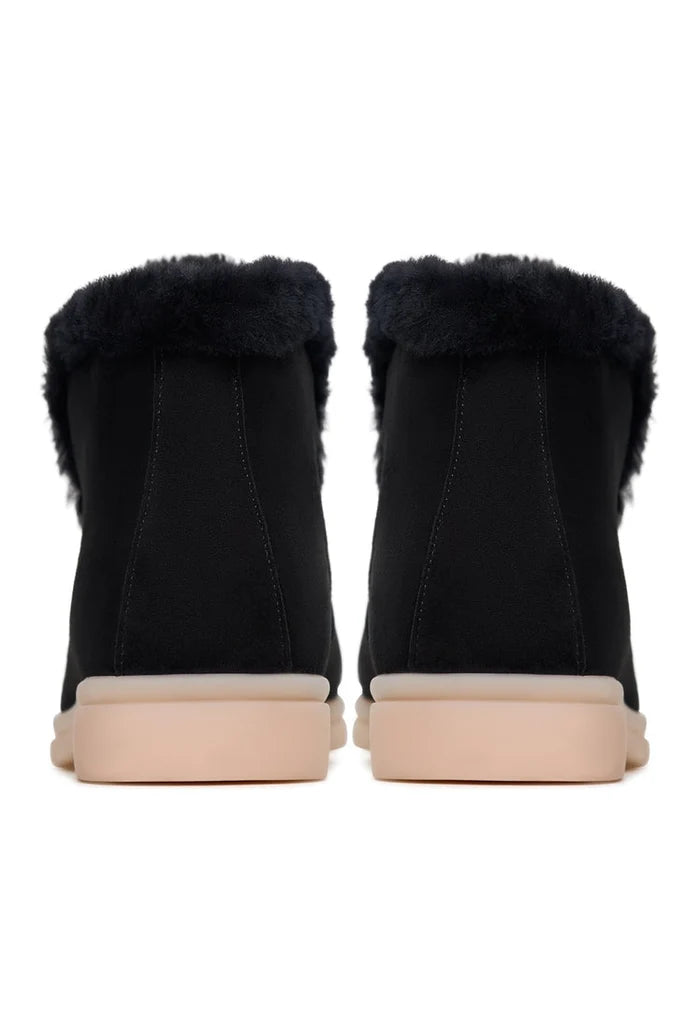 A stylish pair of women's winter ankle boots in black, known as the Antonia boots, perfect for the cold season.